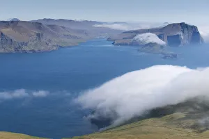 Bank of clouds over Vagar and Mykines, Utoyggjar, Faroe Islands, Denmark Bank of clouds over Vagar and Mykines, Utoyggjar, Faroe Islands, Denmark