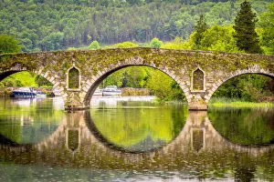 Beautiful Graiguenamanagh stone bridge with trees in the background on a rainy day Beautiful Graiguenamanagh stone bridge with trees in the background on a rainy day