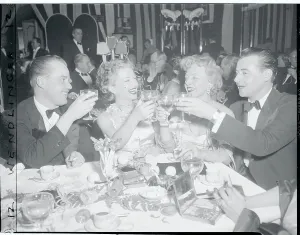 Anne Baxter Sharing a Toast with Colleagues Print