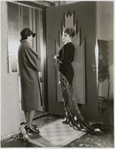 Vintage Women's Clothing Styles Prints: Woman Wearing Peacock Dress Conversing with Another