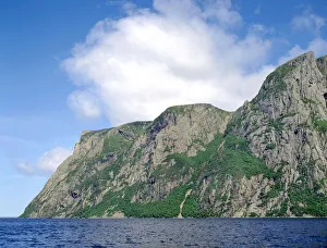 Billion year old rock of Long Range Mountains form steep cliffs above Western Brook Pond Billion year old rock of Long Range Mountains form steep cliffs above Western Brook Pond