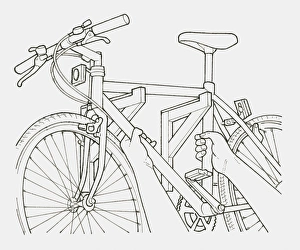 Black and white illustration of hands hanging a bicycle on a pair of brackets on a wall Black and white illustration of hands hanging a bicycle on a pair of brackets on a wall