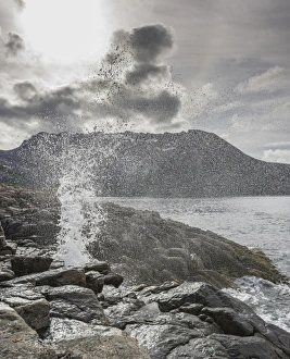 Blowhole on the coast, island of Senja, Troms, Norway Blowhole on the coast, island of Senja, Troms, Norway