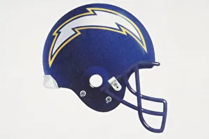 Blue American football helmet with lightning-shaped team logo, side view Blue American football helmet with lightning-shaped team logo, side view
