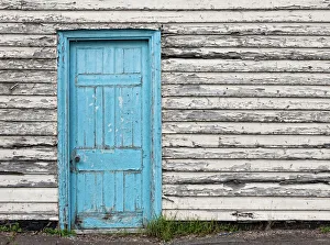 <b class=qtipBold><figcaption>The blue door</figcaption></b><br>A dilapidated blue door, with peeling paint, is set into a wood covered wall with peeling paint in a cream colour. There is an air of ruin and neglect about the scene.<br><em>© ©2015 Stephen Stringer</em> The blue door