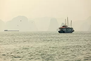 Images Dated 29th December 2013: boats cruising around karst in the world famous place halong bay in north Vietnam
