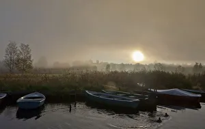 Boats in the fog on Lake Staffelsee with the island of Woerth near Seehausen, Murnau Boats in the fog on Lake Staffelsee with the island of Woerth near Seehausen, Murnau