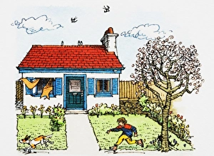Boy chasing pet dog in garden of cottage-style house on chilly day Boy chasing pet dog in garden of cottage-style house on chilly day