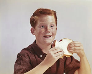Brown Hair Collection: Boy eating sandwich, smiling