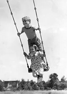 Images Dated 11th October 2005: Boy And Girl On Swing
