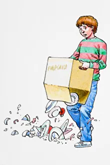 Boy holding box, contents dropping onto floor Boy holding box, contents dropping onto floor