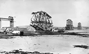 <b class=qtipBold><figcaption>Bridge Building</figcaption></b><br>circa 1888: The Forth Bridge under construction, seen from North Queensferry. The steel cantilever construction was designed by John Fowler and Benjamin Baker to carry a double-track railway line and a road over the river. When it was completed in 1890 it was the longest bridge of its kind and considered a great achievement in engineering. (Photo by Hulton Archive/Getty Images) Bridge Building