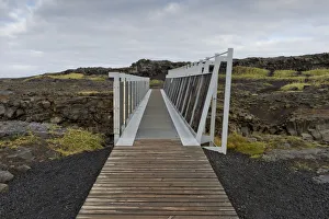 Bridge between the continents crosses the fracture zone between the American and European tectonic plates Bridge between the continents crosses the fracture zone between the American and European tectonic plates