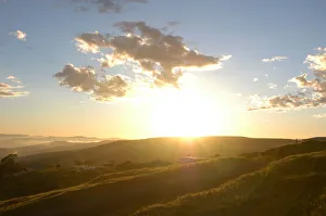 Brilliant sun shine and clouds over green hills in Coffee Bay, Eastern Cape, South Africa Brilliant sun shine and clouds over green hills in Coffee Bay, Eastern Cape, South Africa