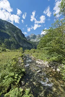 Brook in front of the Watzmann massif, St. Bartholoma in Konigssee, Berchtesgaden National Park Brook in front of the Watzmann massif, St. Bartholoma in Konigssee, Berchtesgaden National Park