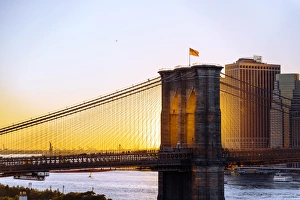 Brooklyn Bridge and Manhattan skyline at sunset, New York City, NY, United States Brooklyn Bridge and Manhattan skyline at sunset, New York City, NY, United States