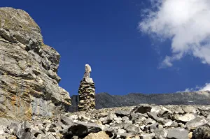 Cairn as signpost and orientation help in rocky alpine terrain without trails, Valais, Switzerland, Europe Cairn as signpost and orientation help in rocky alpine terrain without trails, Valais, Switzerland, Europe