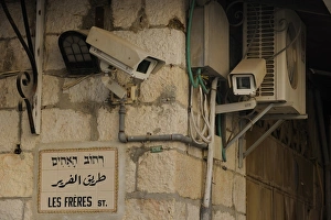 Camera surveillance with street names in the Christian Quarter in the Old City, Jerusalem Camera surveillance with street names in the Christian Quarter in the Old City, Jerusalem