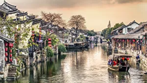 <b class=qtipBold><figcaption>The canal town of Xitang</figcaption></b><br>The ancient town of Xitang, with houses built next to the canals across the town. Boat with red lanterns on the waterway.<br><em>© Copyright Xiaoyu Yu</em> The canal town of Xitang