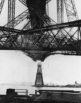 <b class=qtipBold><figcaption>Cantilever</figcaption></b><br>October 1889: The North Cantilever and Garvie Main Pier of the Forth Bridge under construction at Queensferry, Scotland. The steel cantilever construction was designed by John Fowler and Benjamin Baker to carry a double-track railway line and a road over the river. When it was completed in 1890 it was the longest bridge of its kind and considered a great achievement in engineering. Original Publication: Illustrated London News - pub. 1889 (Photo by Hulton Archive/Getty Images) Cantilever