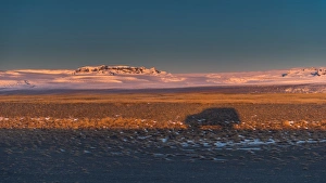 a car shadow cast on an iceland landscape a car shadow cast on an iceland landscape