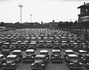 Cars on parking lot, (B&W), elevated view Cars on parking lot, (B&W), elevated view