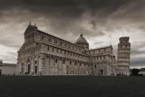 Cathedral and the Pisa Leaning tower in the famous Cathedral Square in the late afternoon Cathedral and the Pisa Leaning tower in the famous Cathedral Square in the late afternoon