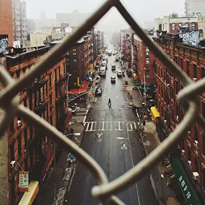 Chinatown seen through fence on a foggy day, NYC Chinatown seen through fence on a foggy day, NYC