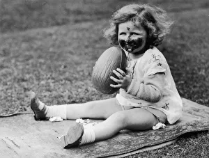 <b class=qtipBold><figcaption>Chocolate Smile</figcaption></b><br>Circa 1930, A little girl makes a pig of herself with a large chocolate Easter egg. (Photo by FPG/Getty Images) Chocolate Smile