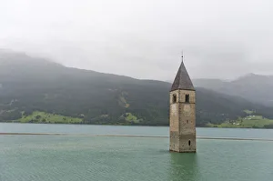 Church tower in the Reschensee lake, Graun im Vinschgau, South Tyrol province Church tower in the Reschensee lake, Graun im Vinschgau, South Tyrol province