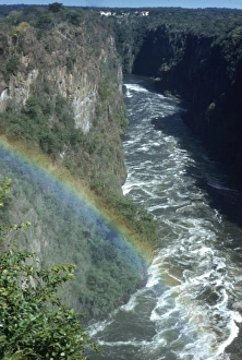 Circa 1955, A rainbow arcs over the gorge of Victoria Falls on the Zambezi River Circa 1955, A rainbow arcs over the gorge of Victoria Falls on the Zambezi River