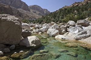 Clear water in the Wadi Shab mountain ravine, Hadjar-Gebirge, Hadschar-Gebirge, Tiwi, Oman Clear water in the Wadi Shab mountain ravine, Hadjar-Gebirge, Hadschar-Gebirge, Tiwi, Oman