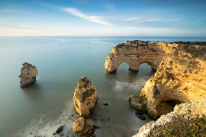 Cliffs framed by turquoise water Praia da Marinha Portugal Cliffs framed by turquoise water Praia da Marinha Portugal