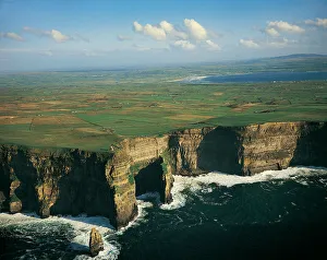 Cliffs Of Moher and Liscannor Bay in background, County Clare, Ireland Cliffs Of Moher and Liscannor Bay in background, County Clare, Ireland
