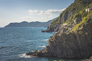The cliffs in front of the port of Riomaggiore, Liguria. Italy The cliffs in front of the port of Riomaggiore, Liguria. Italy