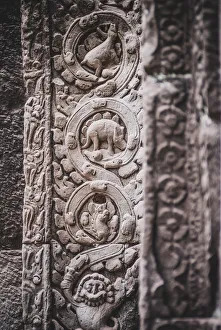 The close up of stone carving of Stegosaurus dinosaur inside Prasat Ta Prohm, Cambodia The close up of stone carving of Stegosaurus dinosaur inside Prasat Ta Prohm, Cambodia