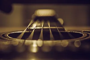 Close up of six string acoustic guitar