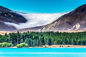 A cloud bank settles in on the mountains above Lake Tekapo, New Zealand A cloud bank settles in on the mountains above Lake Tekapo, New Zealand
