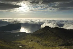 Coastal landscape with Kollur Mountain and the sea stacks of Risin and Kellingin in the evening light, Eioi, Eysturoy, Faroe Islands, Denmark