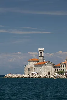 Coastline with the Church of Our Lady of Health, St. Clement Church, and the lighthouse Coastline with the Church of Our Lady of Health, St. Clement Church, and the lighthouse
