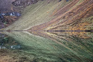 Colorful reflection in a small lake at Thrika camp, Gasa District, Snowman Trek, Bhutan Colorful reflection in a small lake at Thrika camp, Gasa District, Snowman Trek, Bhutan