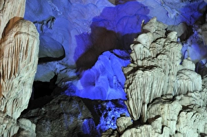 Colourfully, illuminated rock formation in Hang Sung Sot cave, Surprise Cave, Cave of Awe, a UNESCO World Heritage Site Colourfully, illuminated rock formation in Hang Sung Sot cave, Surprise Cave, Cave of Awe, a UNESCO World Heritage Site