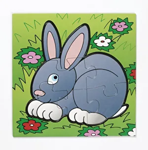 Completed puzzle depicting rabbit in field, close up Completed puzzle depicting rabbit in field, close up