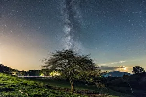 <b class=qtipBold><figcaption>Cosmic Delight</figcaption></b><br>The Milky Way rising above the Blue Ridge Parkway and light trails from the zooming cars.<br><em>© ROBERT LOE</em> Cosmic Delight