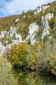 Craggy limestone rocks with a deciduous forest with autumnal colours, Danube Valley Craggy limestone rocks with a deciduous forest with autumnal colours, Danube Valley