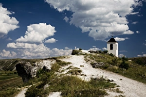Cross and bell tower on a cliff in Orheiul Vechi Cross and bell tower on a cliff in Orheiul Vechi
