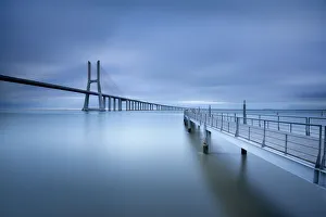 <b class=qtipBold><figcaption>Crossroads</figcaption></b><br>The Ponte Vasco da Gama Lisbon is a massive 17km long bridge that spans the shallow but wide Tagus Estuary to the east of Lisbon. This massive bridge was once Europe longest bridge and was named after Portugal great explorer Vasco da Gama.<br><em>© FredConcha</em> Crossroads