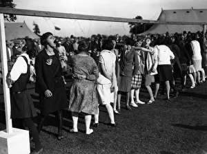<b class=qtipBold><figcaption>Dangling Apples</figcaption></b><br>1928: Women trying to eat apples from the end of pieces of string, at an event organized for the opening of Tottenham sports ground. (Photo by Topical Press Agency/Getty Images) Dangling Apples
