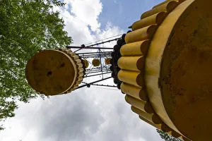 A decaying ferris wheel stands in the abandoned amusement park in the city center of A decaying ferris wheel stands in the abandoned amusement park in the city center of
