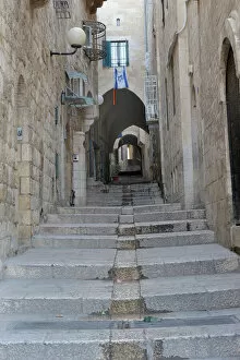 Jerusalem Gallery: Deserted alleyway with Israeli flag hanging from a window above an archway, Muslim Quarter